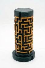 Load image into Gallery viewer, A black cylindrical puzzle container with a matching lid, featuring a 3D laser-engraved maze pattern on the body, set against a plain white background.